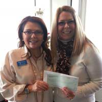 Carrie Green, Three Rivers Community Foundation presents Cavalcade Founder Michelle Lane with a check to sponsor author Matt de la Peña